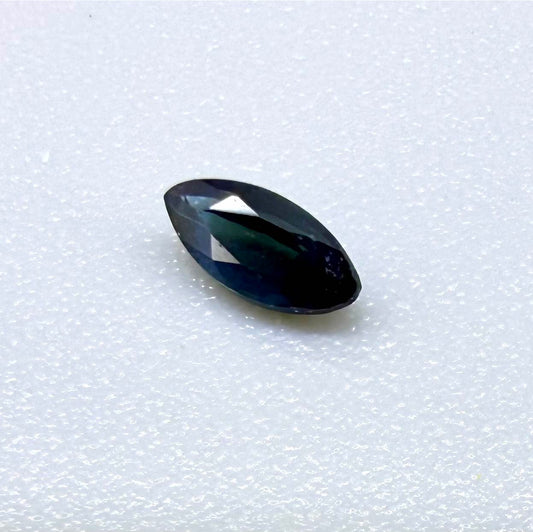 Marquise dark teal blue sapphire from Bangkaja, Thailand with deep blue-green tone and natural color zoning.