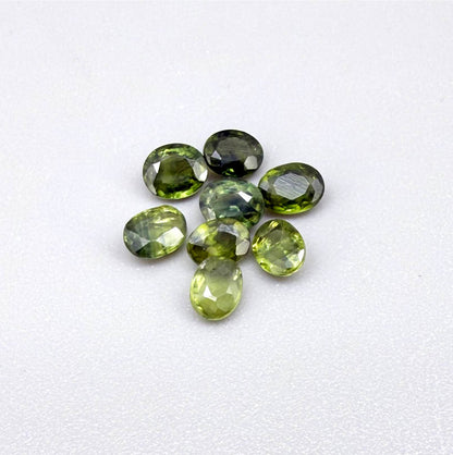 Lot of oval green sapphires from Thailand, 3.02ct total weight, unheated, with fresh to olive-green tones, mostly eye-clean to lightly included and transparent appearance.