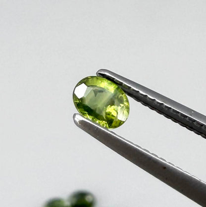 Lot of oval green sapphires from Thailand, 3.02ct total weight, unheated, with fresh to olive-green tones, mostly eye-clean to lightly included and transparent appearance.