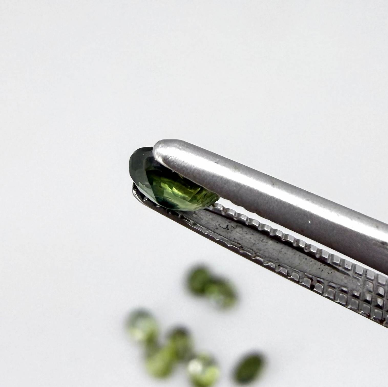 Lot of oval green sapphires from Thailand, 3.02ct total weight, unheated, with fresh to olive-green tones, mostly eye-clean to lightly included and transparent appearance.