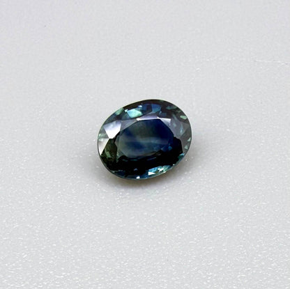 Heated blue sapphire from Mambila Nigeria oval cut 0.85 ct with vivid teal-blue flashes and brilliant natural luster
