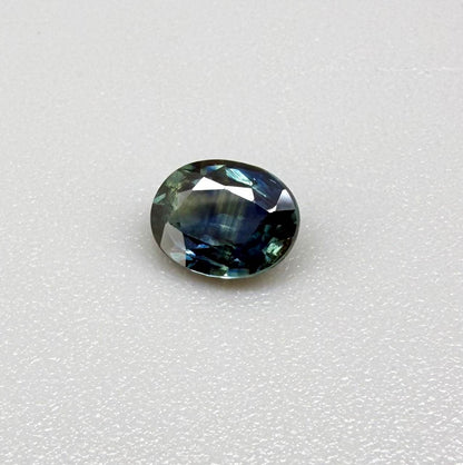Heated blue sapphire from Mambila Nigeria oval cut 0.85 ct with vivid teal-blue flashes and brilliant natural luster