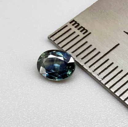 Heated blue sapphire from Mambila Nigeria oval cut 0.85 ct with vivid teal-blue flashes and brilliant natural luster