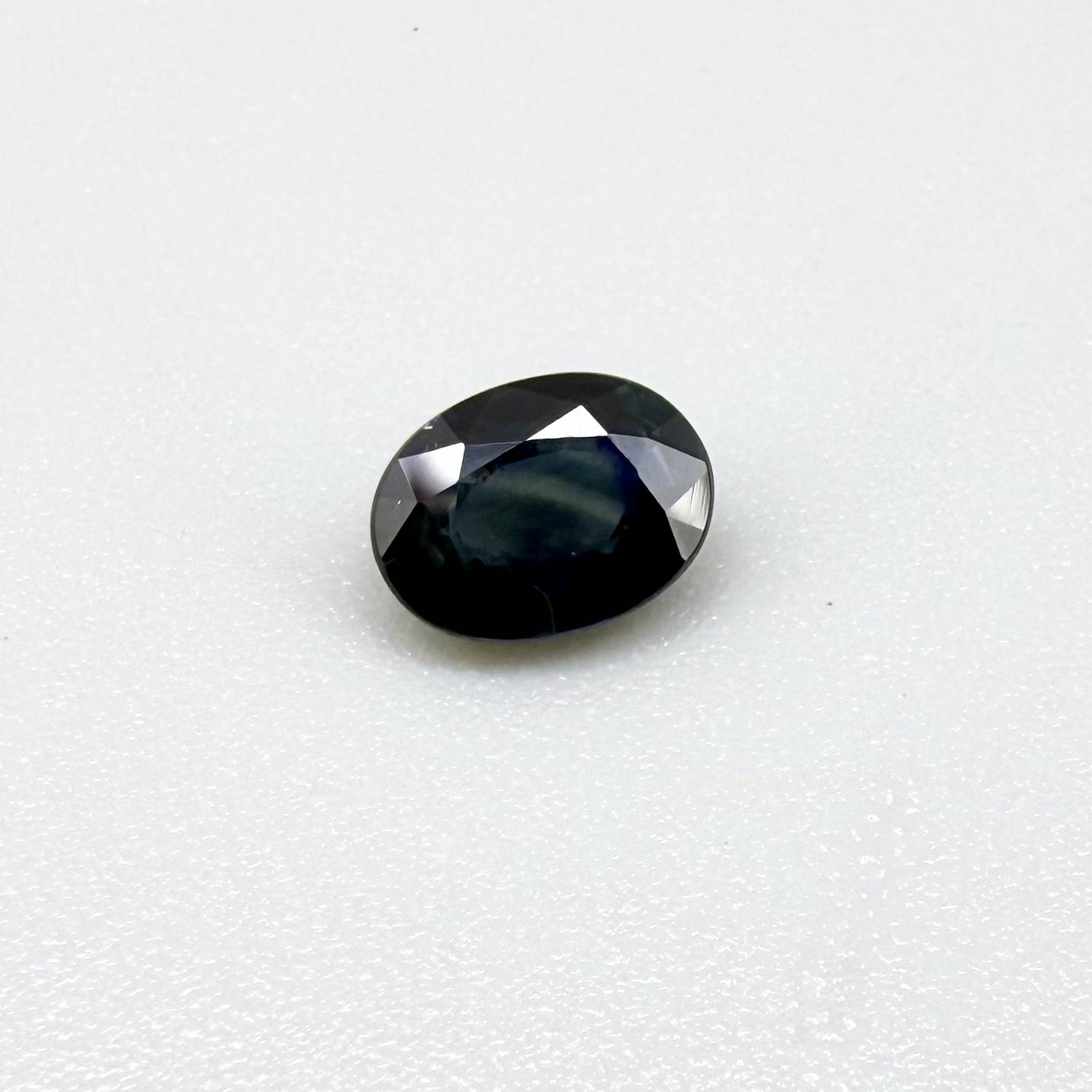 Untreated dark blue Thailand sapphire oval cut 1.02 ct with elegant inky blue color and vivid blue reflections
