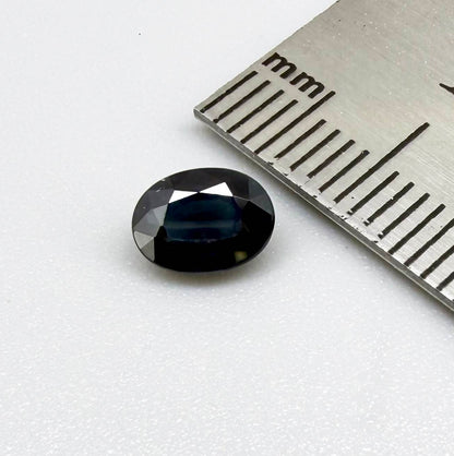 Untreated dark blue Thailand sapphire oval cut 1.02 ct with elegant inky blue color and vivid blue reflections