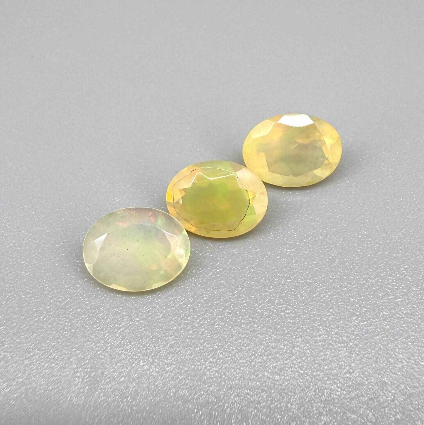 Natural Milky Yellow play-of-color Opal gemstone set, oval cut