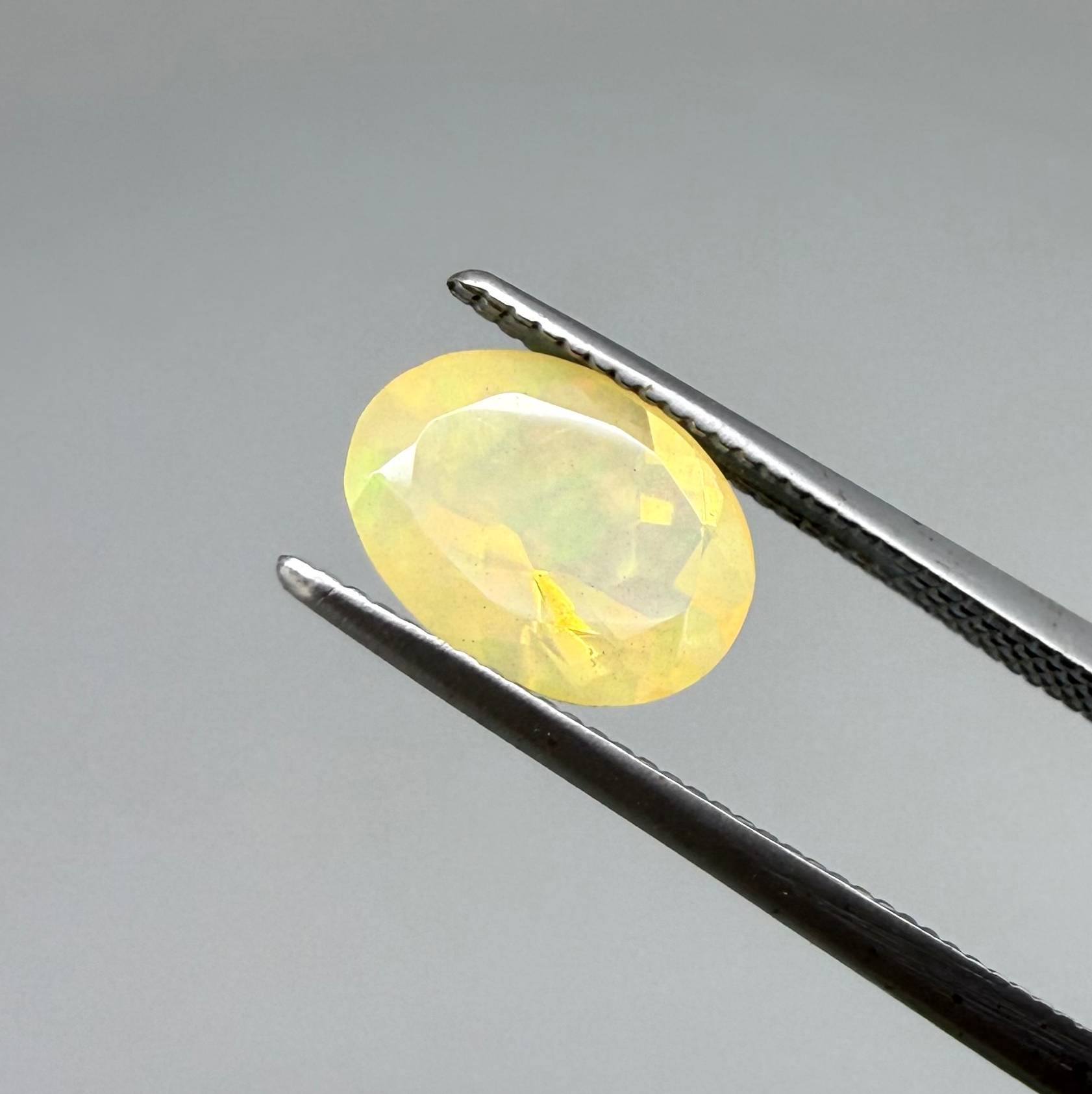 Natural Milky Yellow play-of-color Opal gemstone set, oval cut