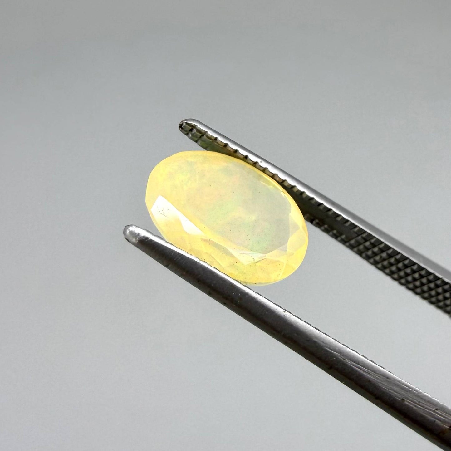 Natural Milky Yellow play-of-color Opal gemstone set, oval cut
