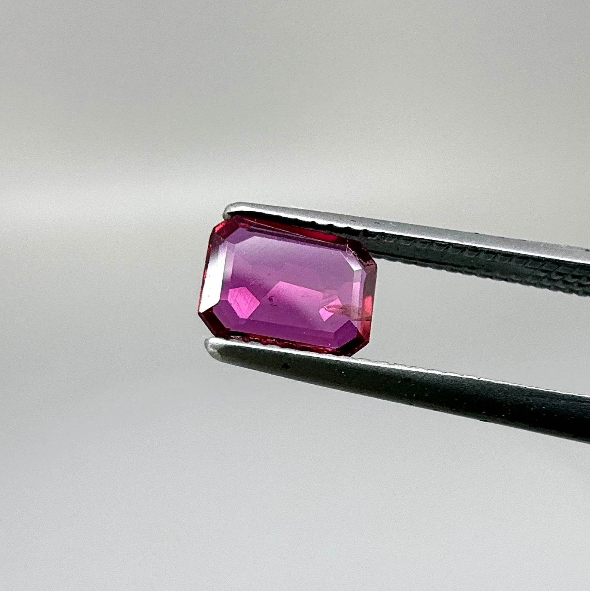 Heated ruby from Bo Rai Thailand, octagon cut, 0.55 ct with rich purplish-red color and elegant faceting.