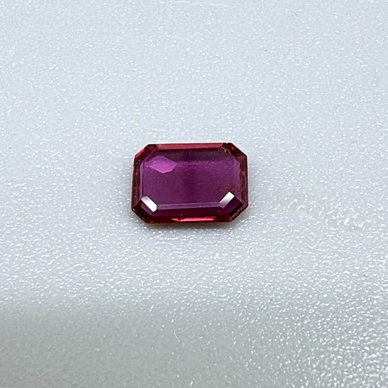 Heated ruby from Bo Rai Thailand, octagon cut, 0.55 ct with rich purplish-red color and elegant faceting.