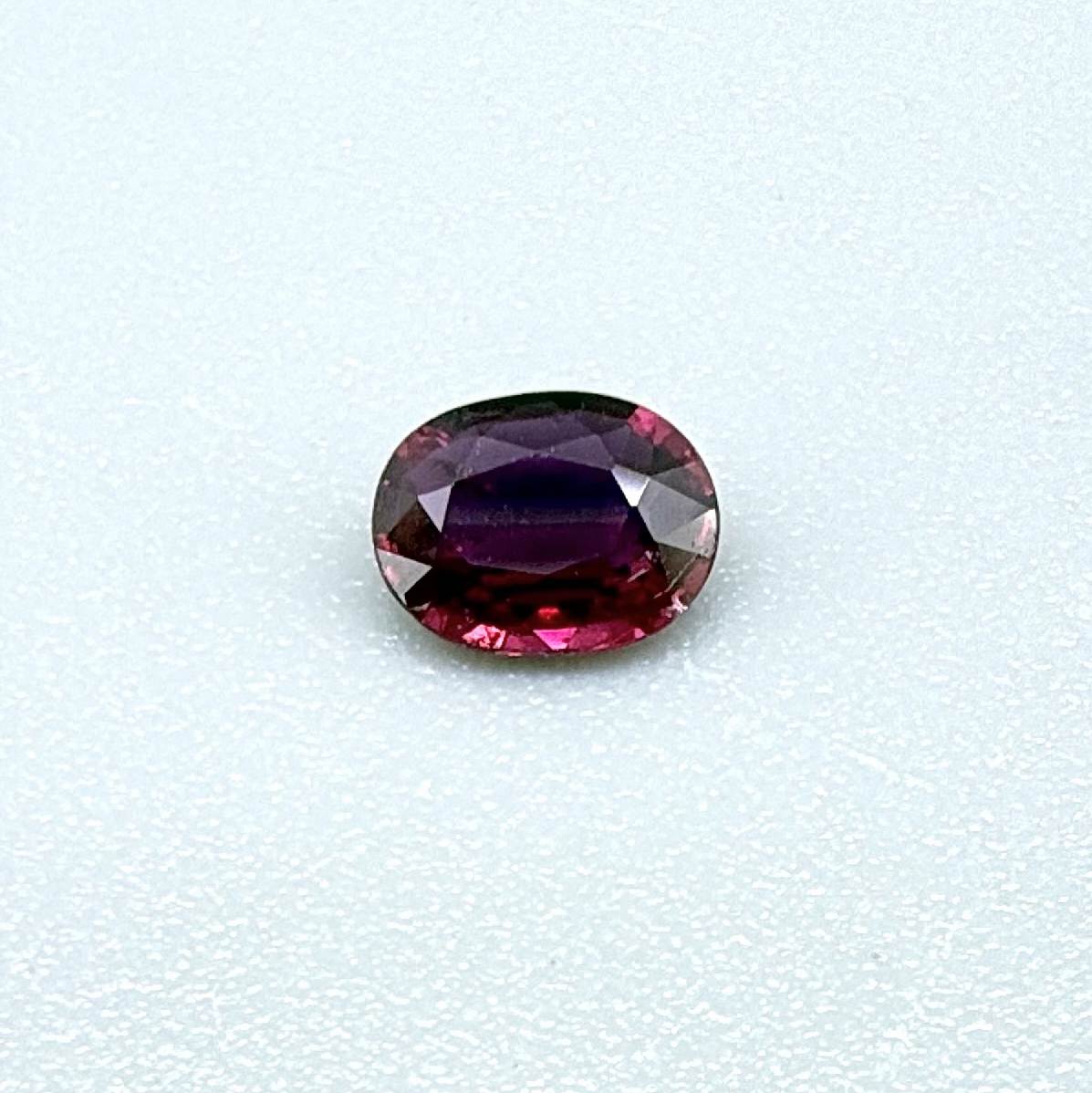 Heated ruby from Bo Rai Thailand, oval cut, 0.50 ct with vivid purplish-red color and natural brilliance.