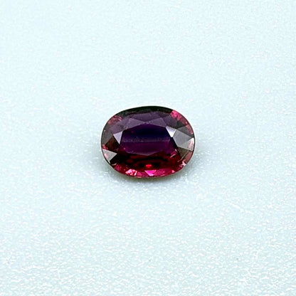 Heated ruby from Bo Rai Thailand, oval cut, 0.50 ct with vivid purplish-red color and natural brilliance.