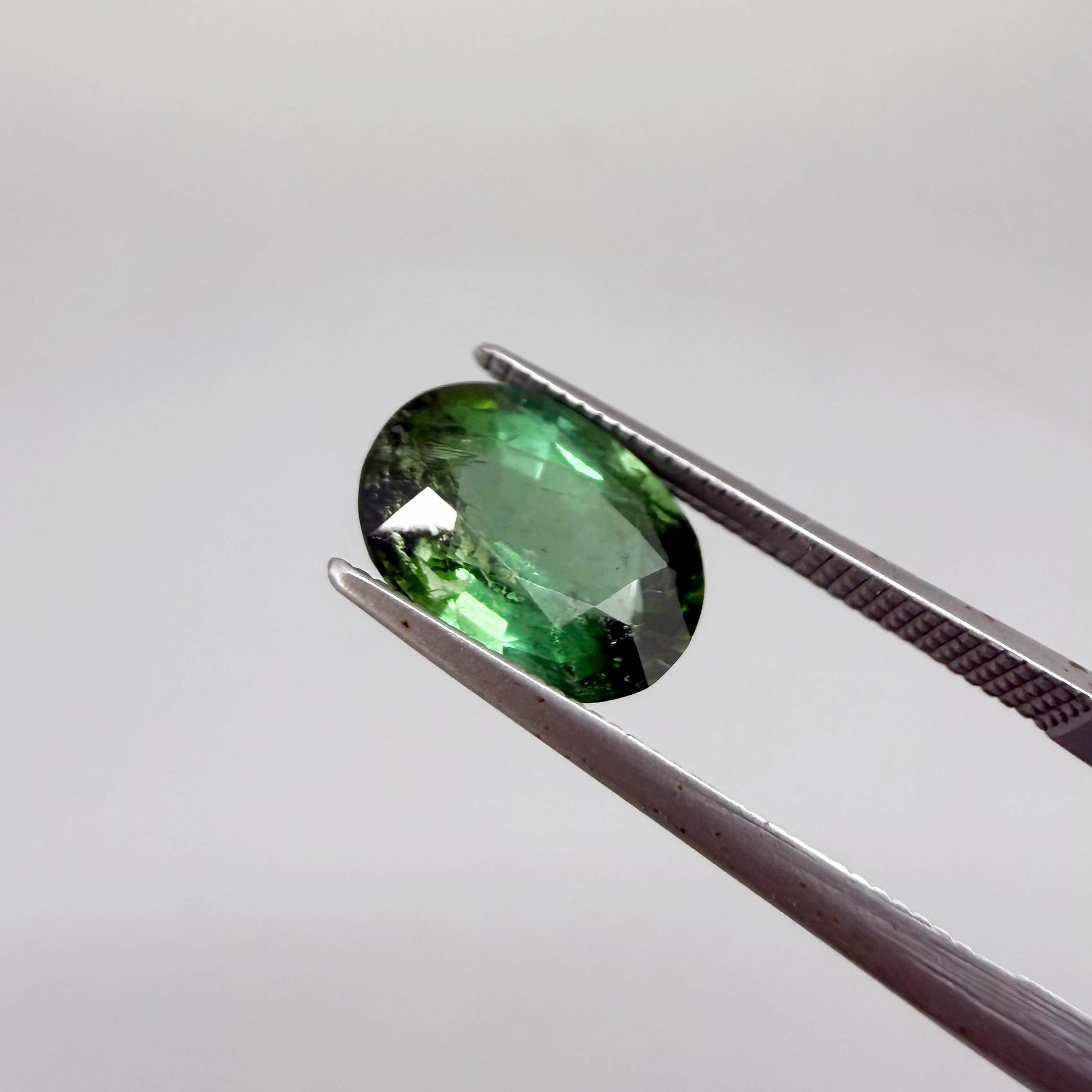 Natural green tourmaline from Africa, oval cut, 3.17 ct with vibrant green color and natural brilliance.
