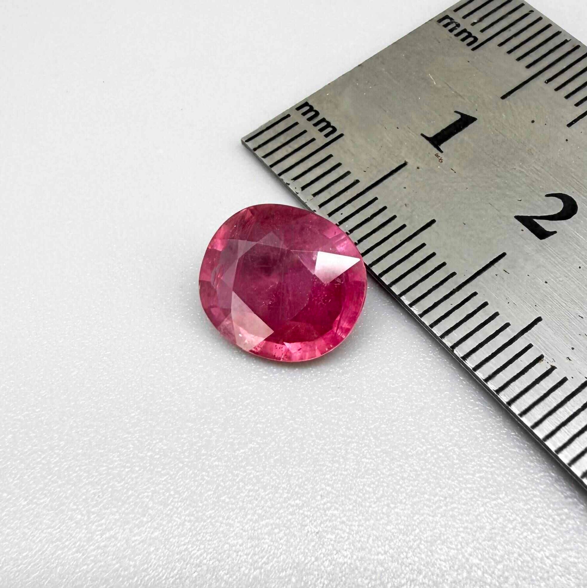 Natural Ruby 4.91 ct from Mozambique – treated oval faceted gemstone with vivid pinkish-red color