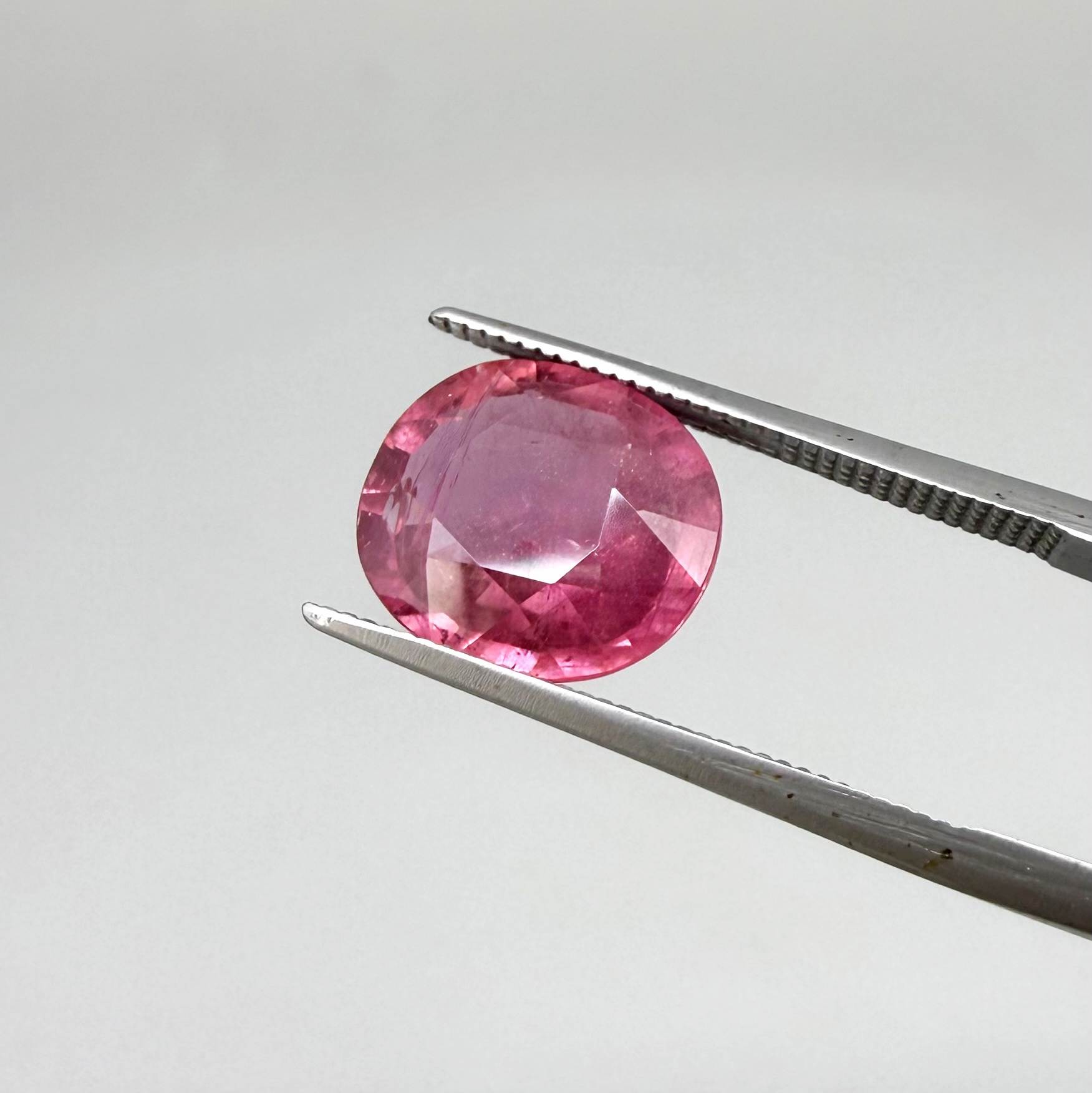 Natural Ruby 4.91 ct from Mozambique – treated oval faceted gemstone with vivid pinkish-red color