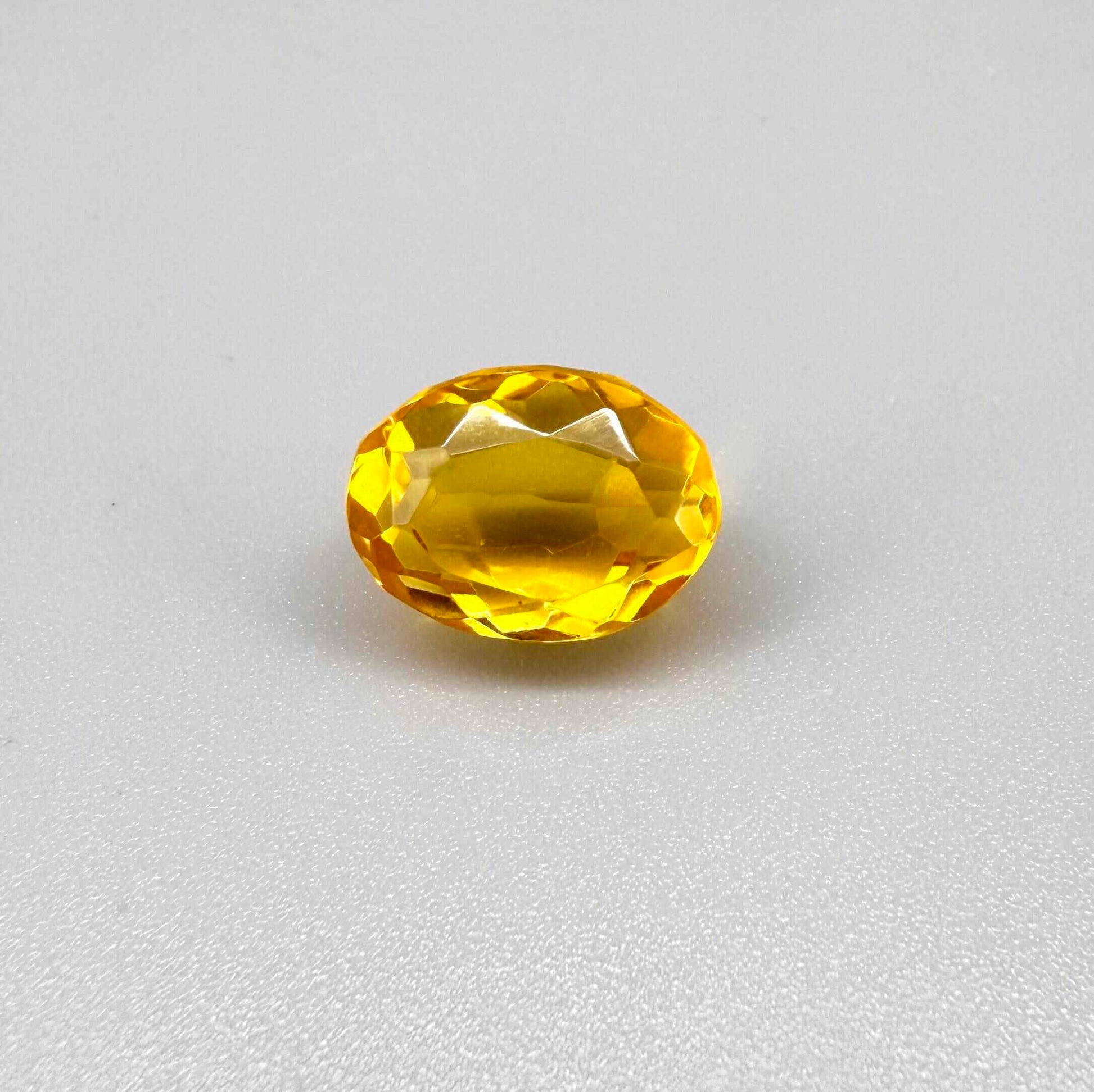 Natural Citrine 10.49 ct from Brazil – unheated oval faceted gemstone with vibrant golden-yellow color and exceptional clarity