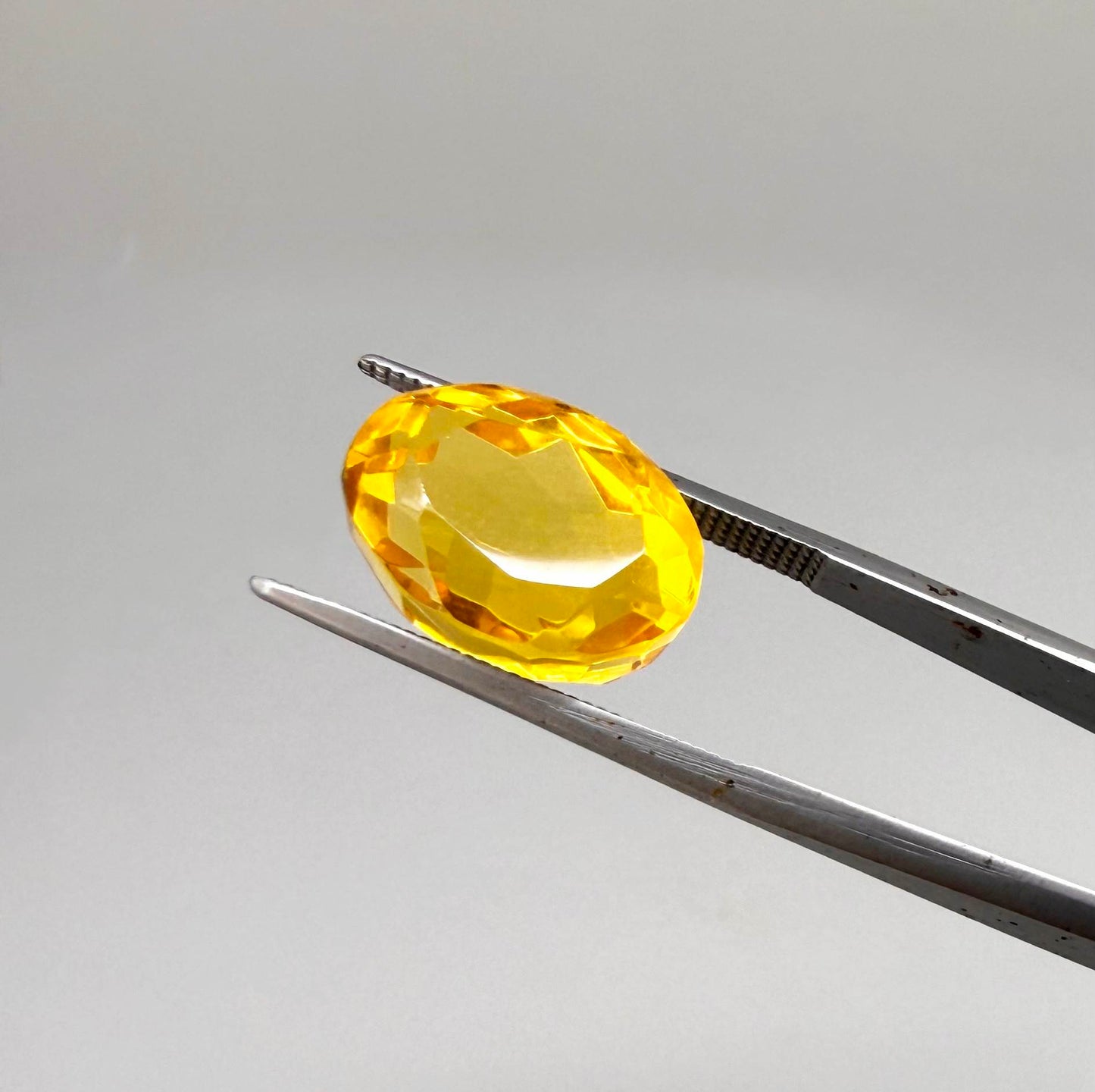 Natural Citrine 10.49 ct from Brazil – unheated oval faceted gemstone with vibrant golden-yellow color and exceptional clarity