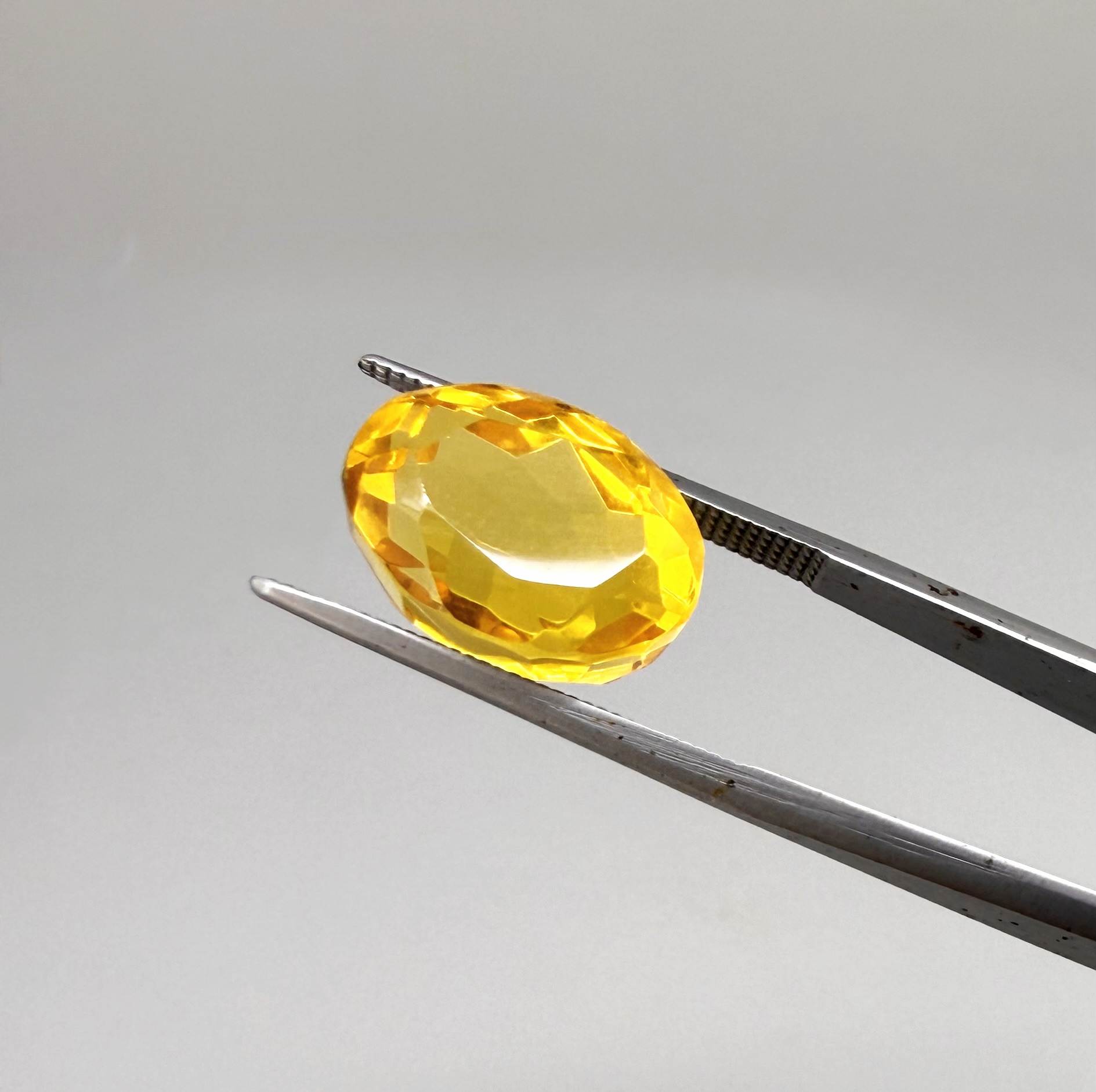 Natural Citrine 10.49 ct from Brazil – unheated oval faceted gemstone with vibrant golden-yellow color and exceptional clarity