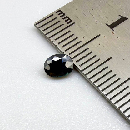 0.56 ct teal Laos sapphire in oval cut, heated and eye-clean with captivating blue-green color.