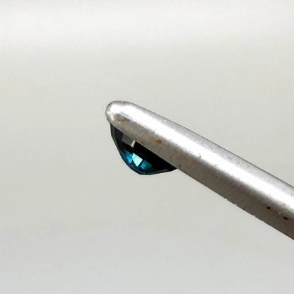 0.56 ct teal Laos sapphire in oval cut, heated and eye-clean with captivating blue-green color.