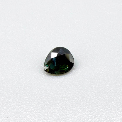 0.62 ct teal Laos sapphire in oval cut, heated and eye-clean with captivating blue-green color.