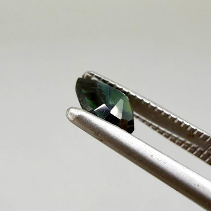 0.62 ct teal Laos sapphire in oval cut, heated and eye-clean with captivating blue-green color.