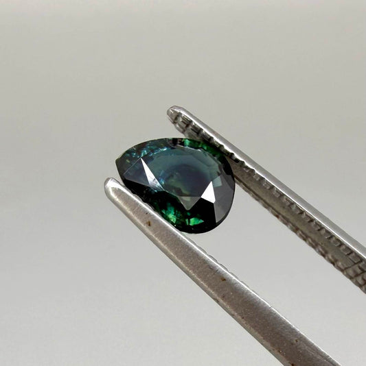 0.62 ct teal Laos sapphire in oval cut, heated and eye-clean with captivating blue-green color.