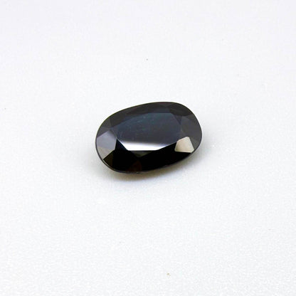 Natural heated deep teal Laos sapphire, 3.18 ct oval with eye-clean clarity and vivid blue-green flashes.