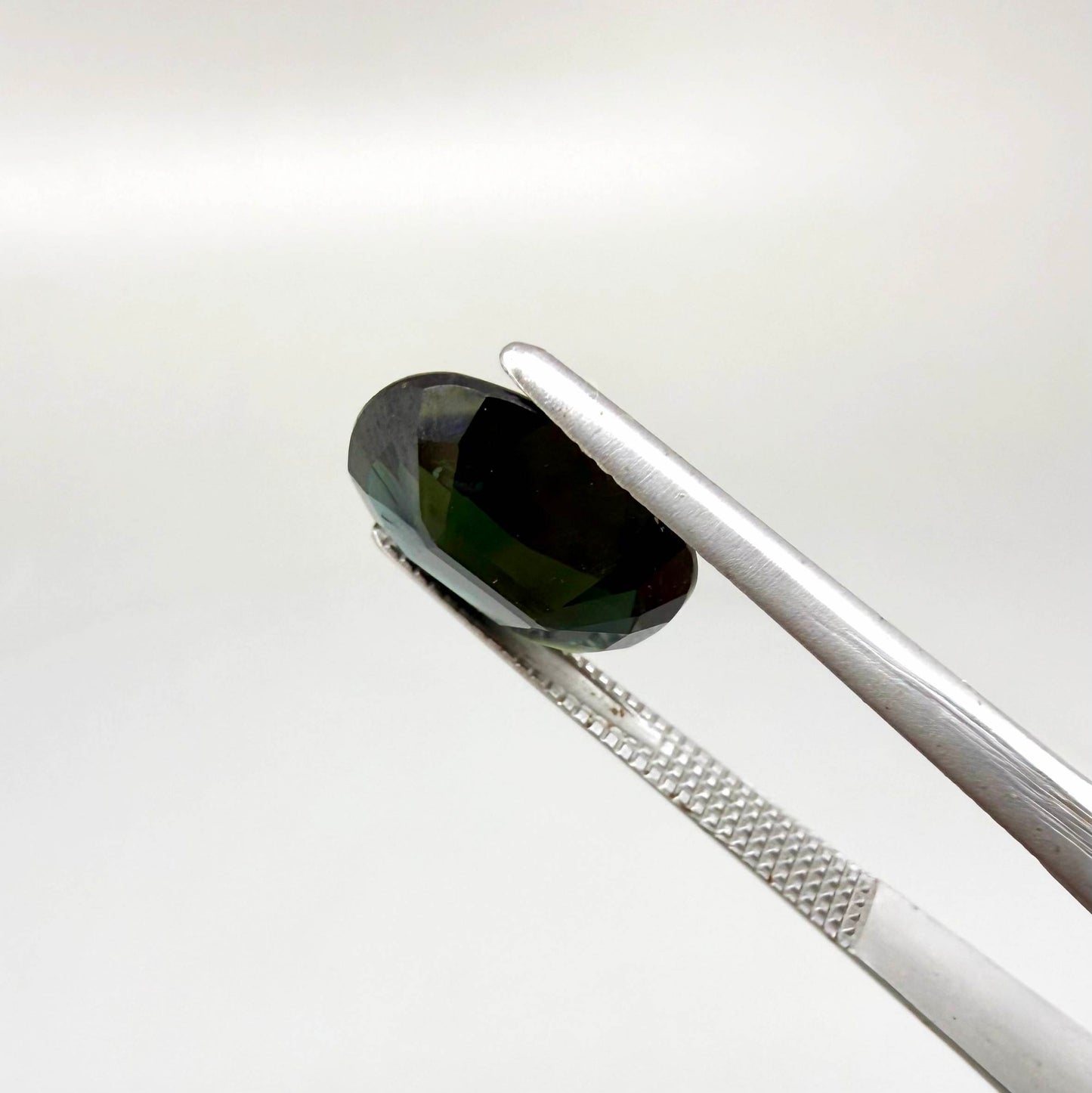 Natural heated dark blue Laos sapphire weighing 3.65 ct, oval cut with eye-clean clarity and a rich deep blue colour.