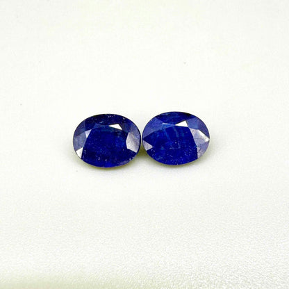 Large natural enhanced deep blue sapphire matching pair 7.71 ct oval faceted gemstones for earrings