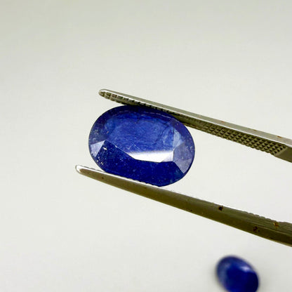 Large natural enhanced deep blue sapphire matching pair 7.71 ct oval faceted gemstones for earrings