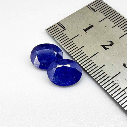 Large natural enhanced deep blue sapphire matching pair 7.71 ct oval faceted gemstones for earrings