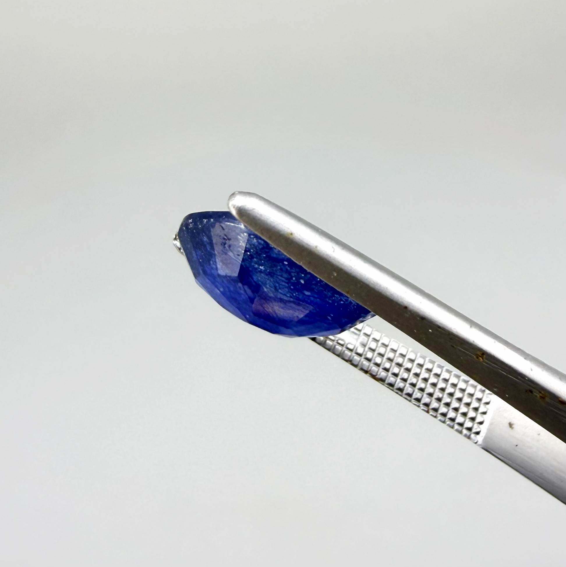 Large natural enhanced deep blue sapphire matching pair 7.71 ct oval faceted gemstones for earrings