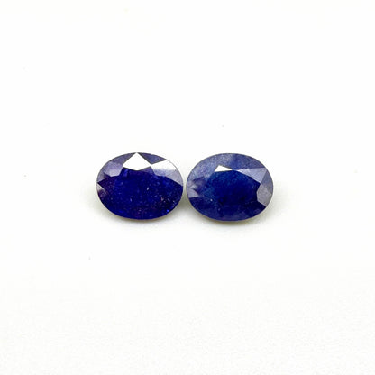 10.36 ct natural enhanced deep blue sapphire matching pair with oval faceted cut for custom earrings