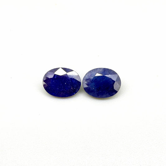 10.36 ct natural enhanced deep blue sapphire matching pair with oval faceted cut for custom earrings