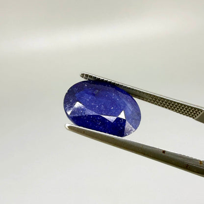 10.36 ct natural enhanced deep blue sapphire matching pair with oval faceted cut for custom earrings