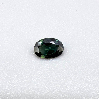 0.28 ct natural heated teal Laos sapphire with oval faceted cut and exceptional clarity
