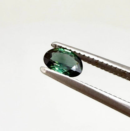 0.28 ct natural heated teal Laos sapphire with oval faceted cut and exceptional clarity