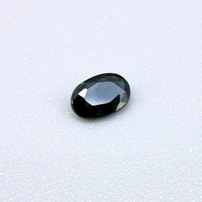 0.28 ct natural heated teal Laos sapphire with oval faceted cut and eye-clean clarity