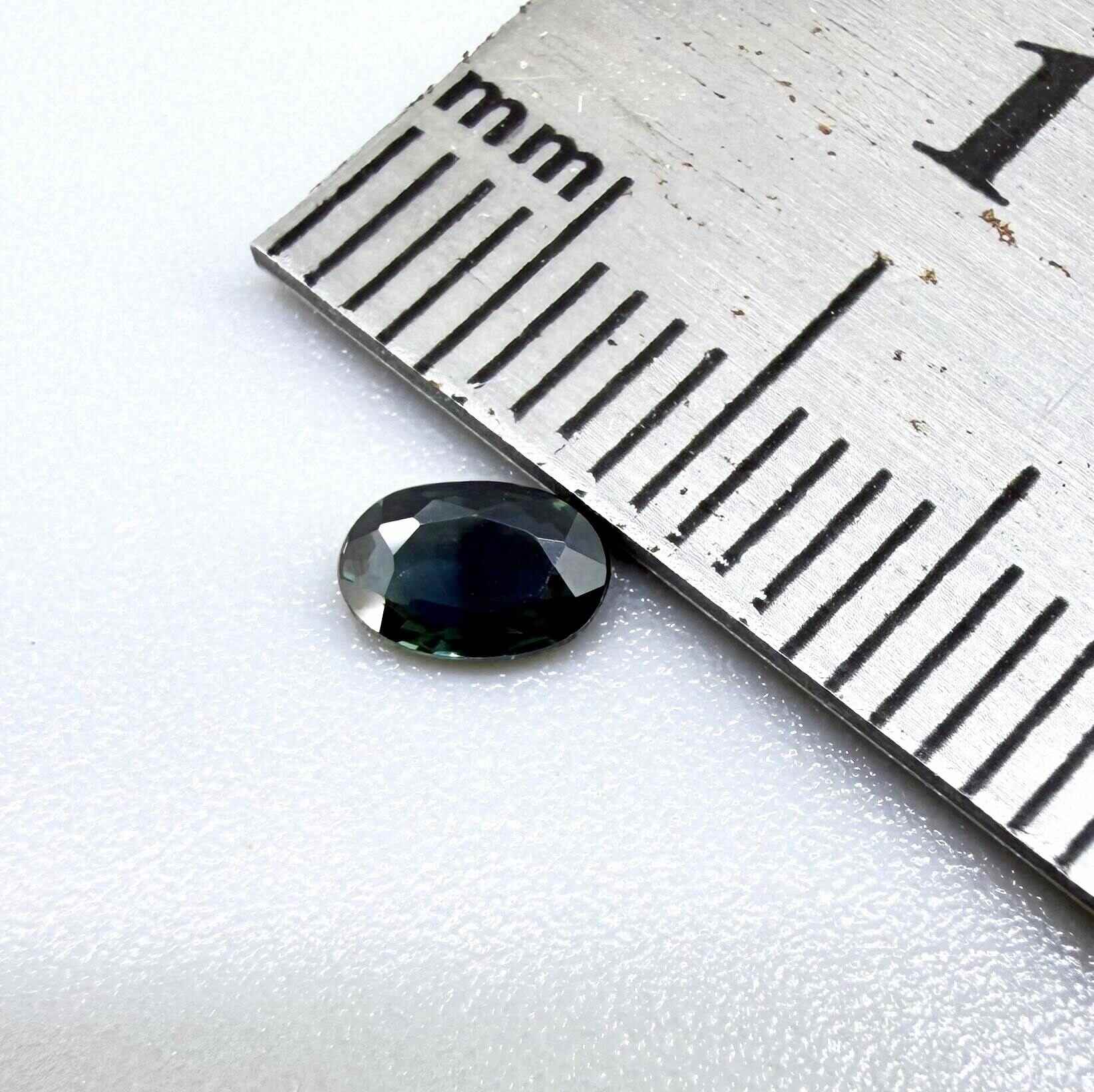 0.28 ct natural heated blue-green Laos sapphire with oval faceted cut and eye-clean clarity