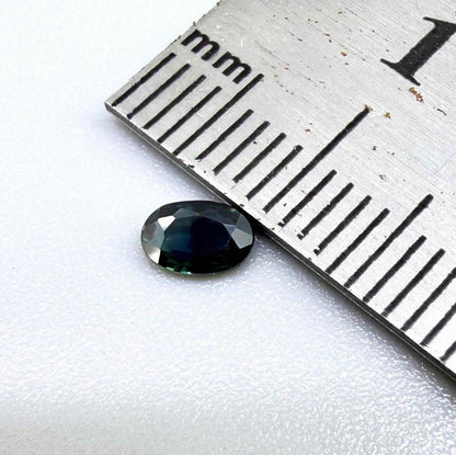 0.28 ct natural heated blue-green Laos sapphire with oval faceted cut and eye-clean clarity