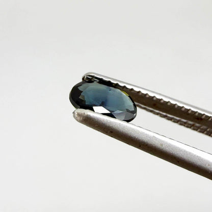 0.28 ct natural heated teal Laos sapphire with oval faceted cut and eye-clean clarity