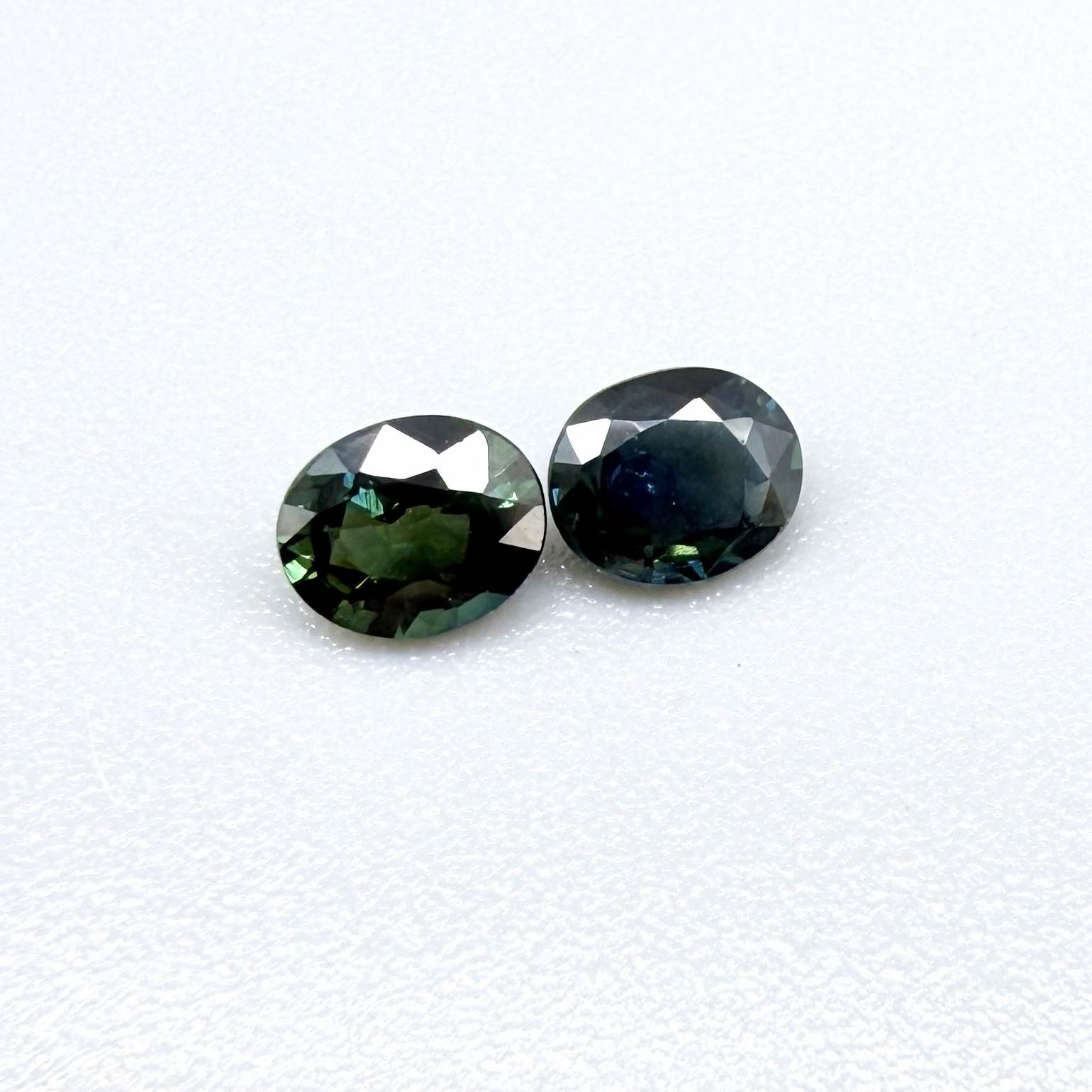 0.92 ct natural heated teal Laos sapphire matching pair with oval faceted cut for custom earrings