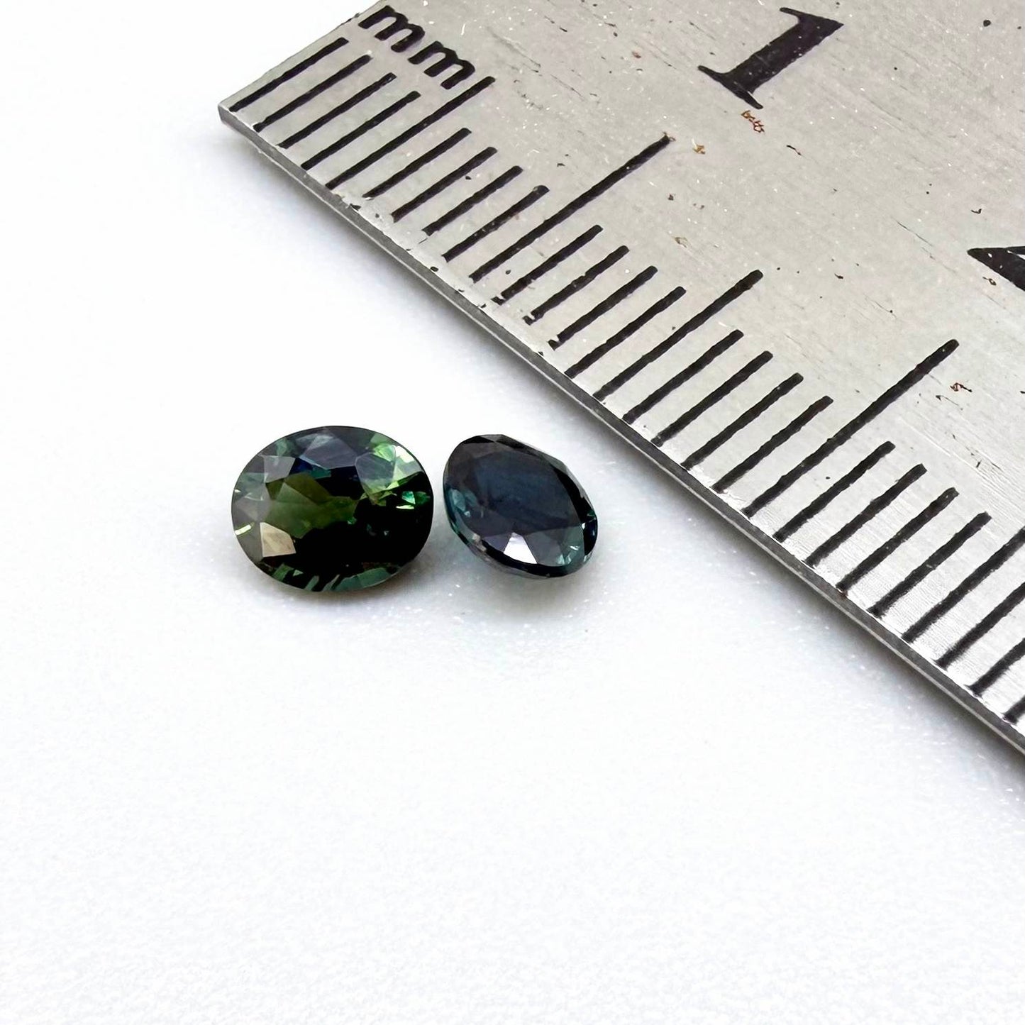 0.92 ct natural heated teal Laos sapphire matching pair with oval faceted cut for custom earrings