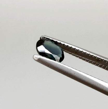 0.32 ct natural deep teal Laos sapphire with oval faceted cut and rich blue green colour