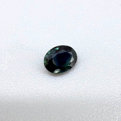0.32 ct natural deep teal Laos sapphire with oval faceted cut and rich blue green colour