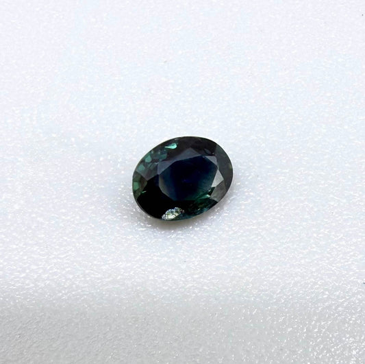 0.32 ct natural deep teal Laos sapphire with oval faceted cut and rich blue green colour
