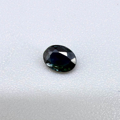 0.32 ct natural deep teal Laos sapphire with oval faceted cut and rich blue green colour