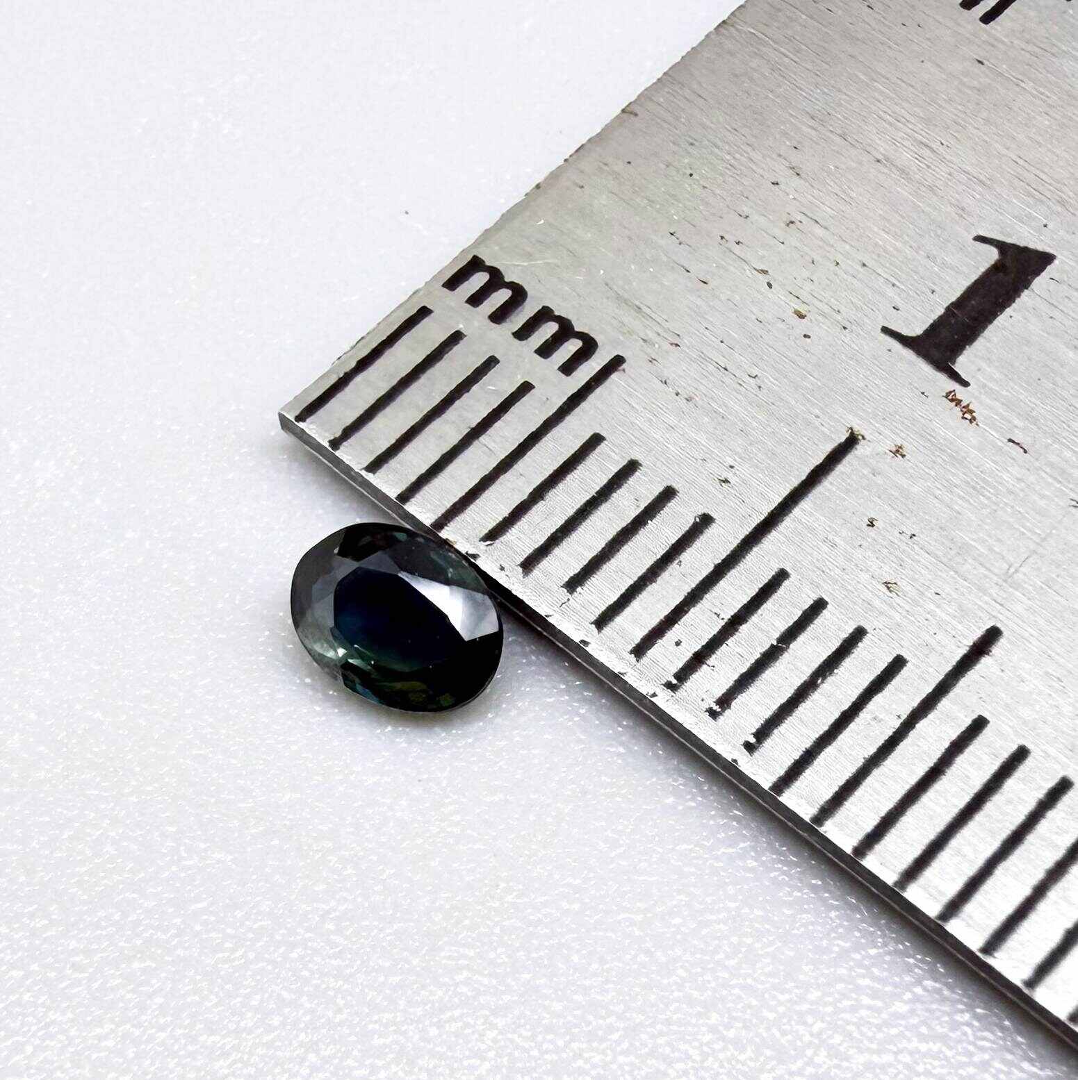 0.32 ct natural deep teal Laos sapphire with oval faceted cut and rich blue green colour