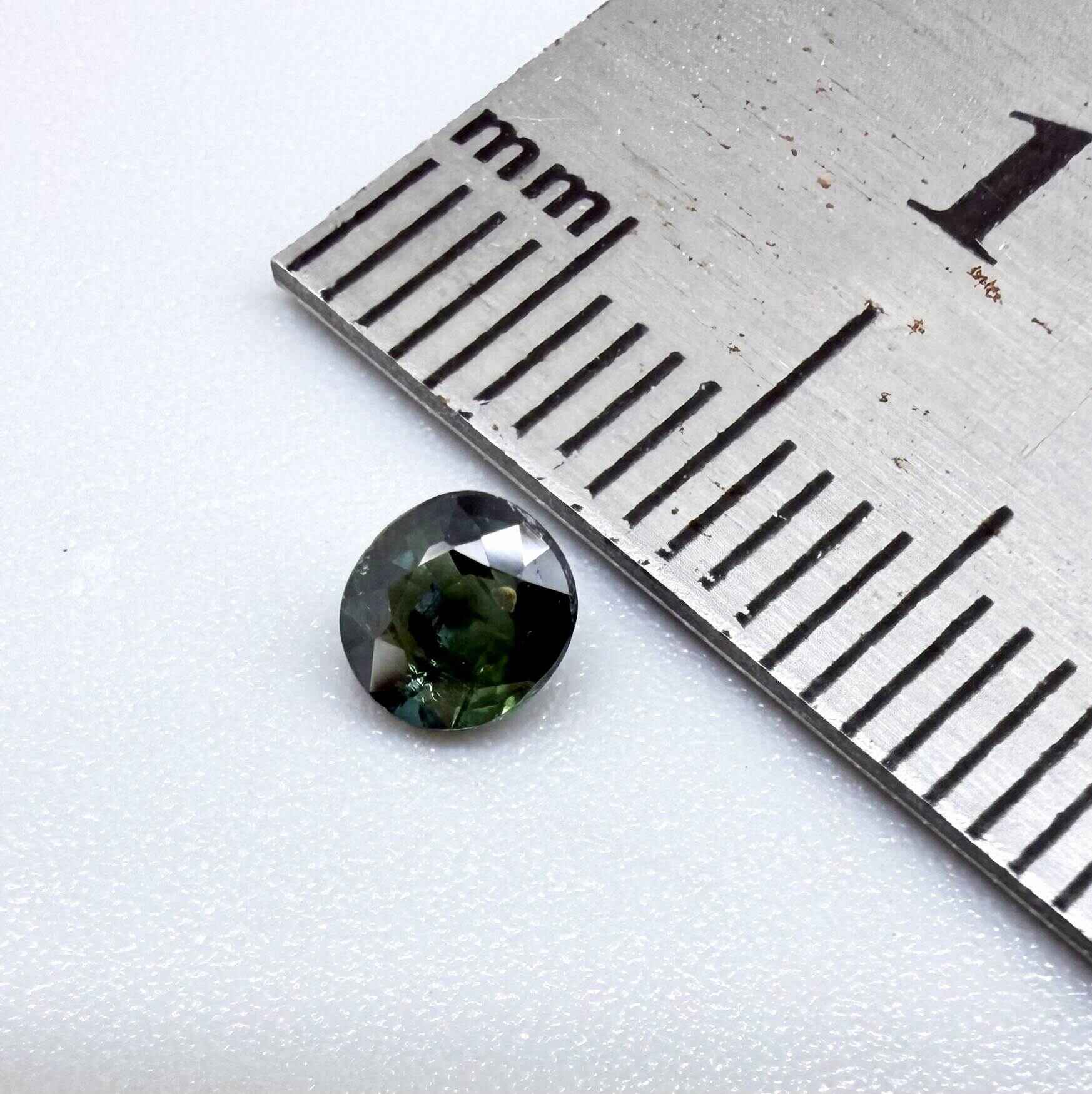 0.32 ct natural teal Laos sapphire with oval-cushion faceted cut and vibrant blue green colour